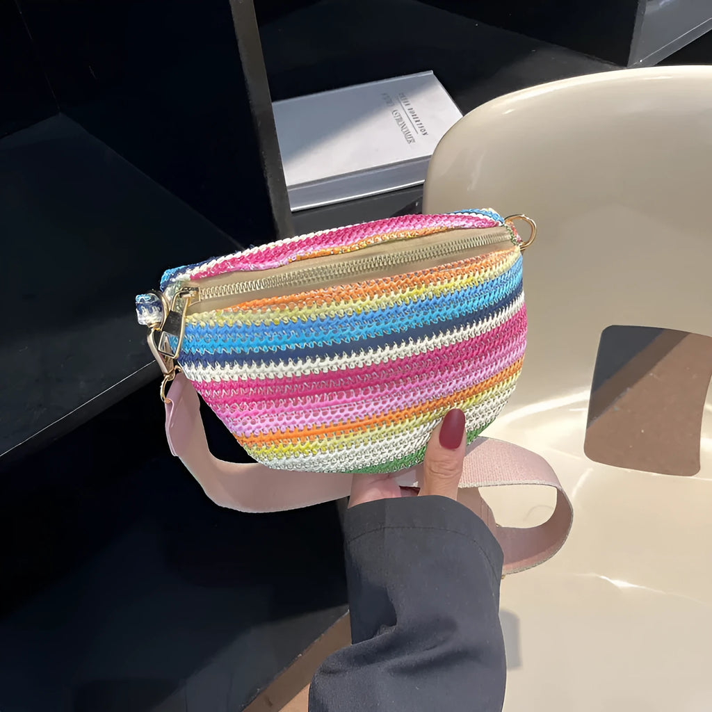 Women's woven straw beach bag with shell shape and single shoulder strap in pink colour
