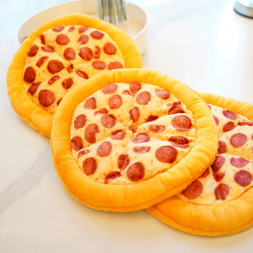Yellow pizza slice shaped plush dog chewing toy with a squeaker for medium and small dogs.