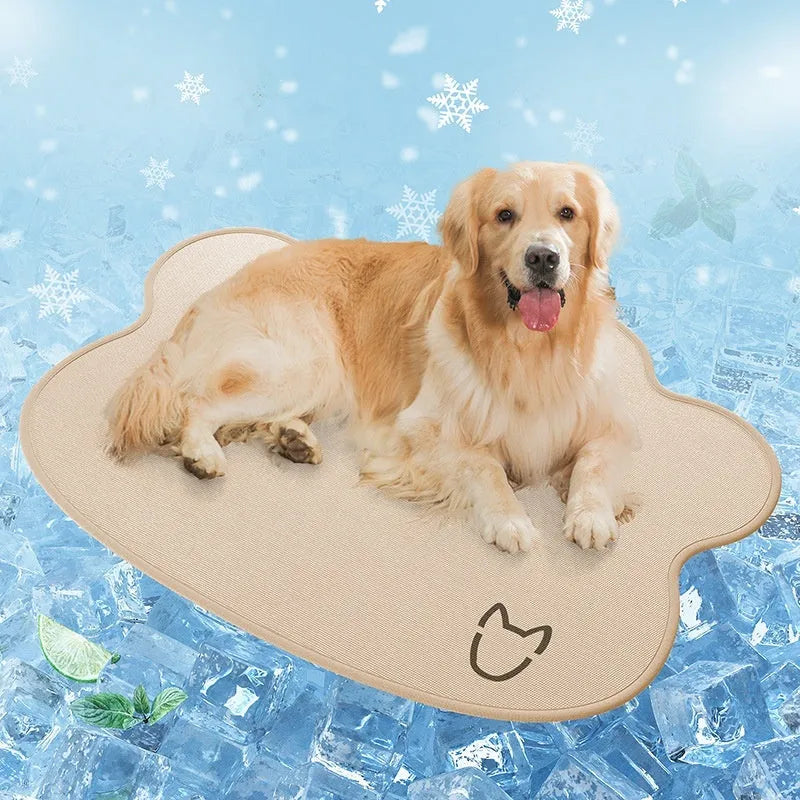 Ice silk dog cooling mat with dog head profile pattern in dark gray, non-slip base, shown on a wooden floor.