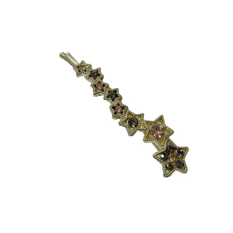 Gold hair barrette clip with rhinestone star detail on side
