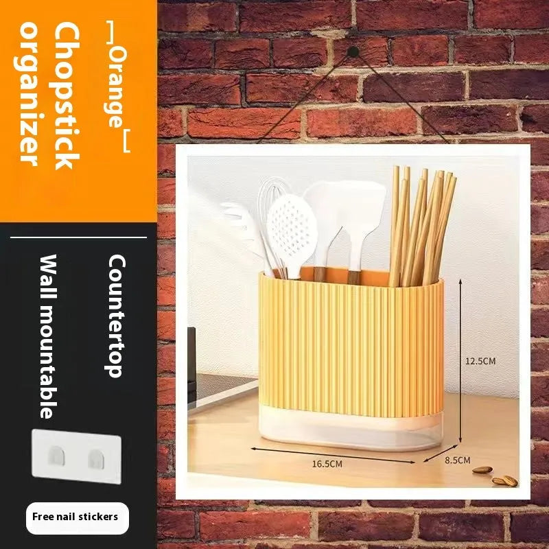 Plastic wall-mounted chopstick and spoon basket in cross-bar design on kitchen wall
