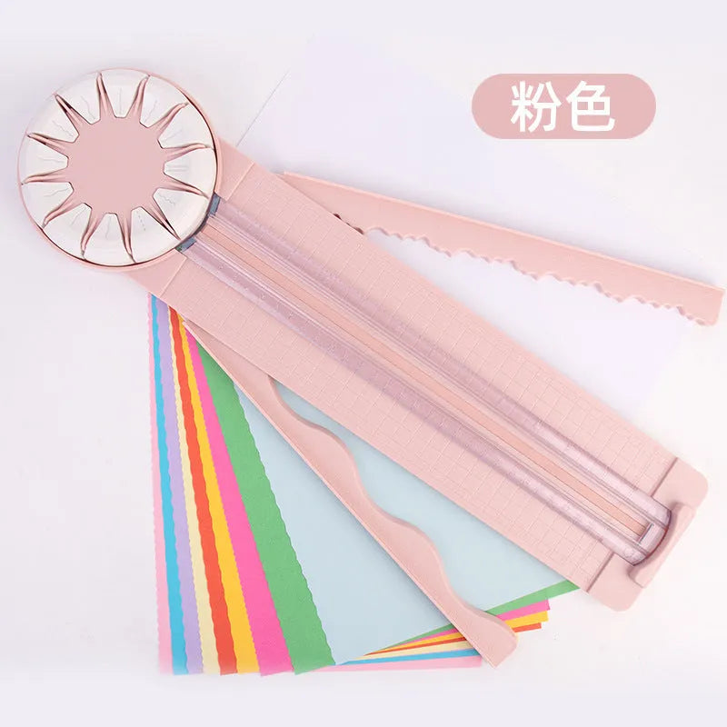 Plastic 12-in-1 paper cutter machine with dotted guide lines in pink colour on white background