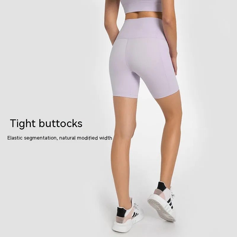 Women's tight-fitting mid-length sport shorts in black cotton blend fabric.