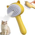 Blue cat steam brush with ergonomic handle, soft rubber bristles, and release button for pet grooming