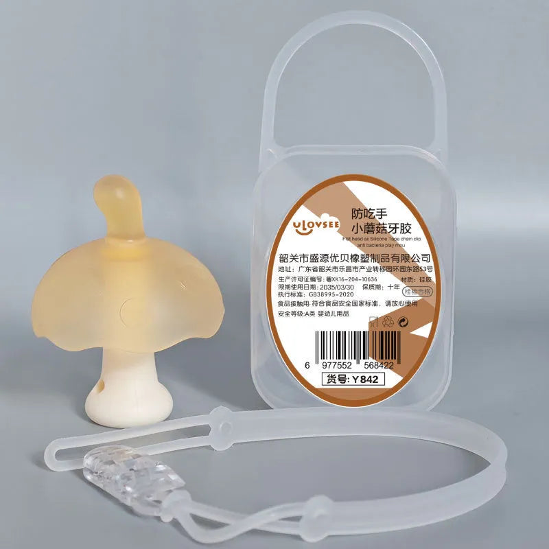 Small mushroom-shaped pink chewing gum inside a transparent box with a silver chain attached.
