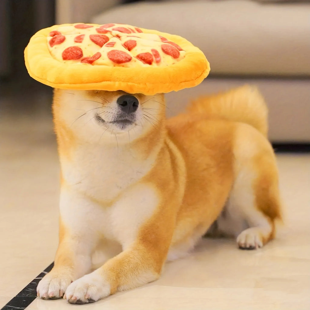 Yellow pizza slice shaped plush dog chewing toy with a squeaker for medium and small dogs.
