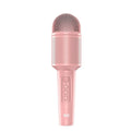 Wireless Bluetooth karaoke microphone in girly pink colour with integrated speaker grill and USB port.
