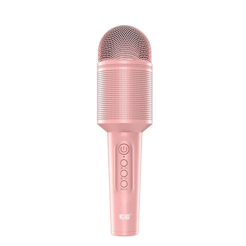Wireless Bluetooth karaoke microphone in girly pink colour with integrated speaker grill and USB port.