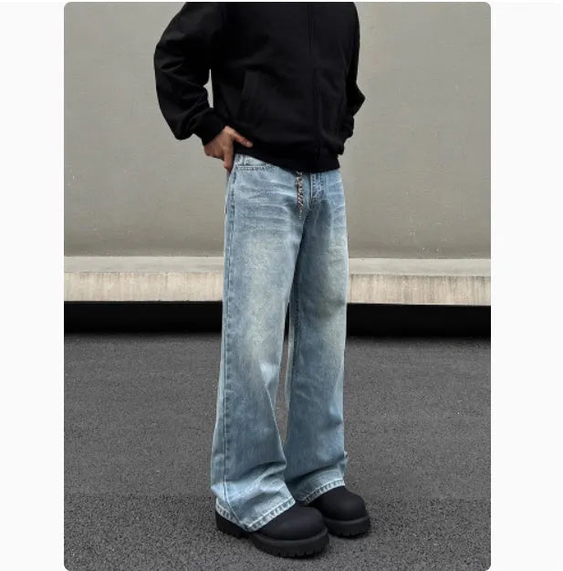 Men's blue straight leg jeans with whisker wash detailing and visible stitching on medium-high waist