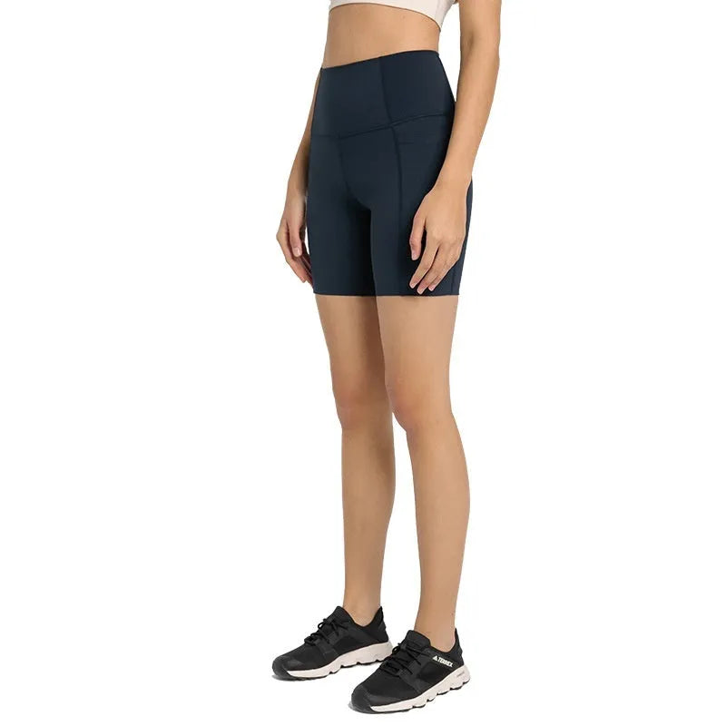 Women's tight-fitting mid-length sport shorts in black cotton blend fabric.