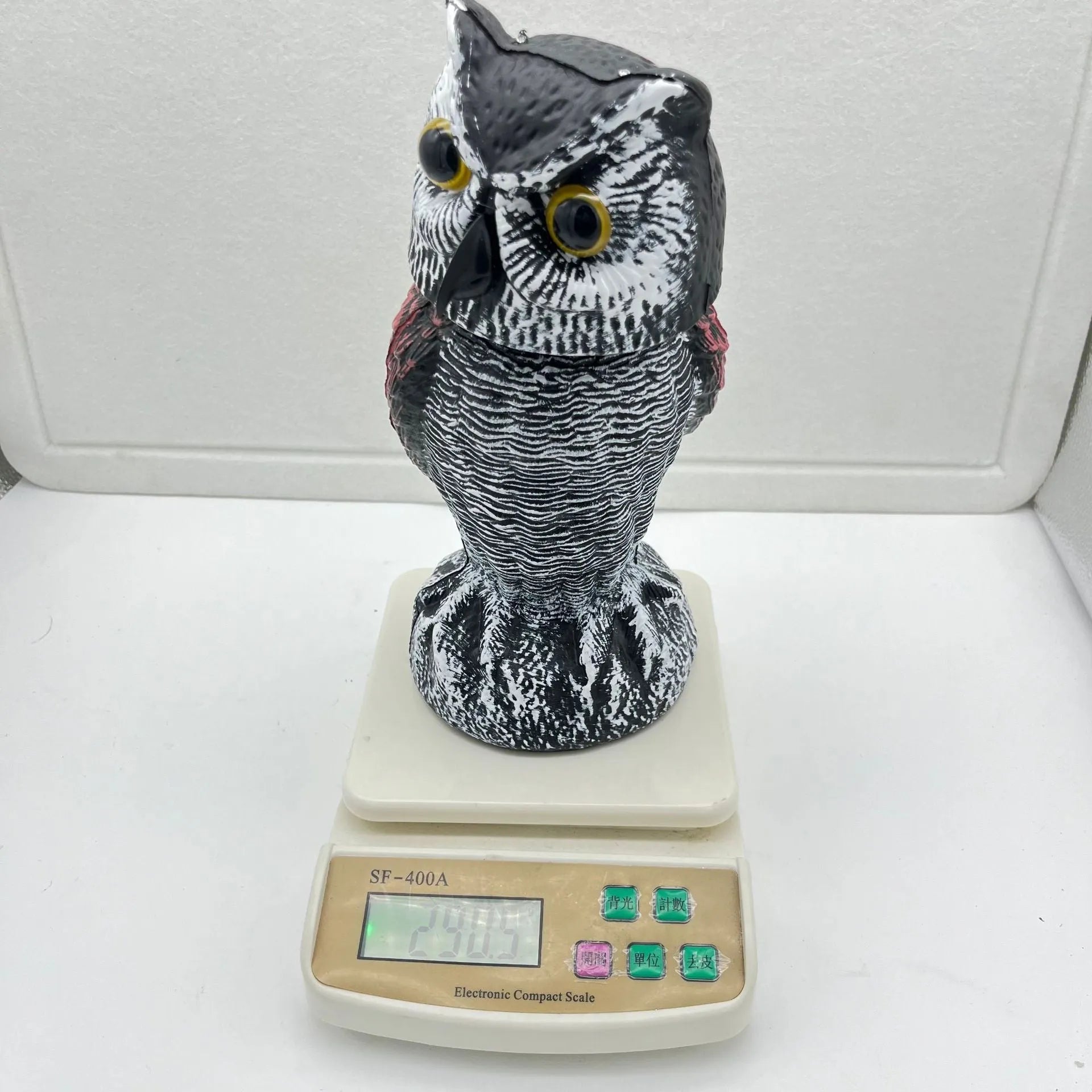 Artificial owl bird deterrent decoy with realistic features for outdoor garden use