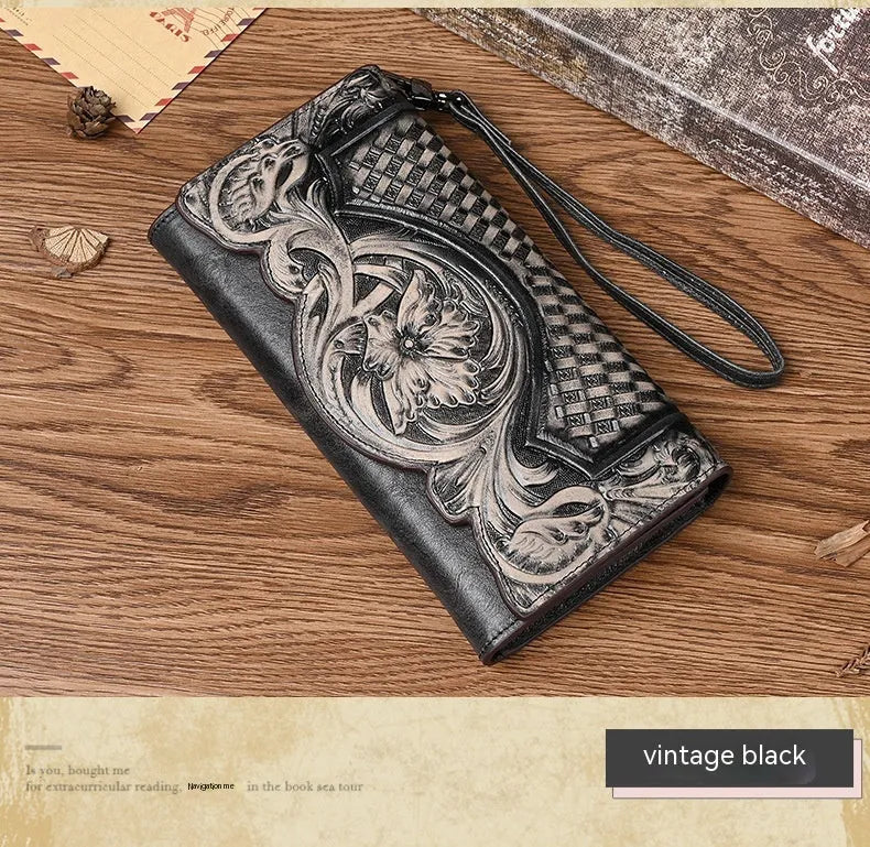 Women's brown tri-fold leather wallet with embossed Chinese floral pattern showing multiple compartments