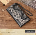 Women's brown tri-fold leather wallet with embossed Chinese floral pattern showing multiple compartments