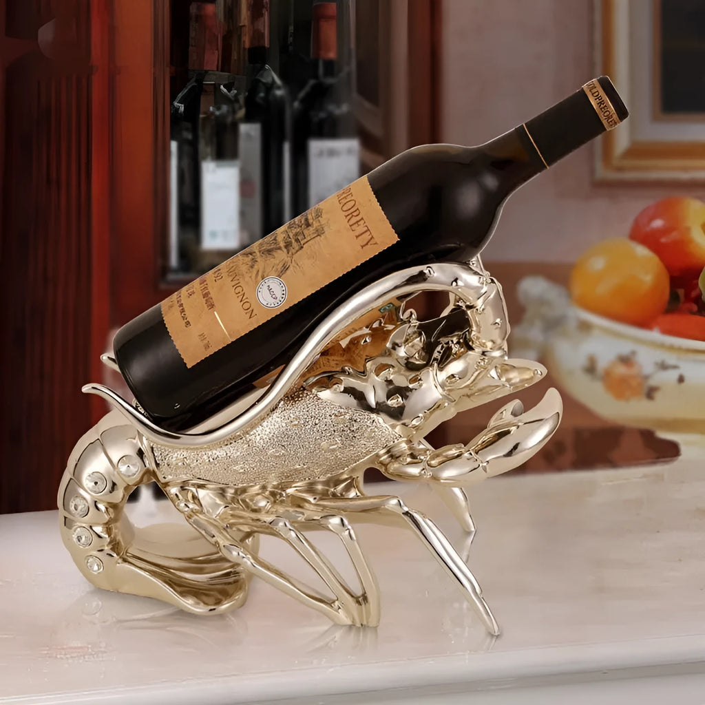 Lobster-shaped wine rack theme ornament in rose gold or silver resin and plastic finish on a shelf.
