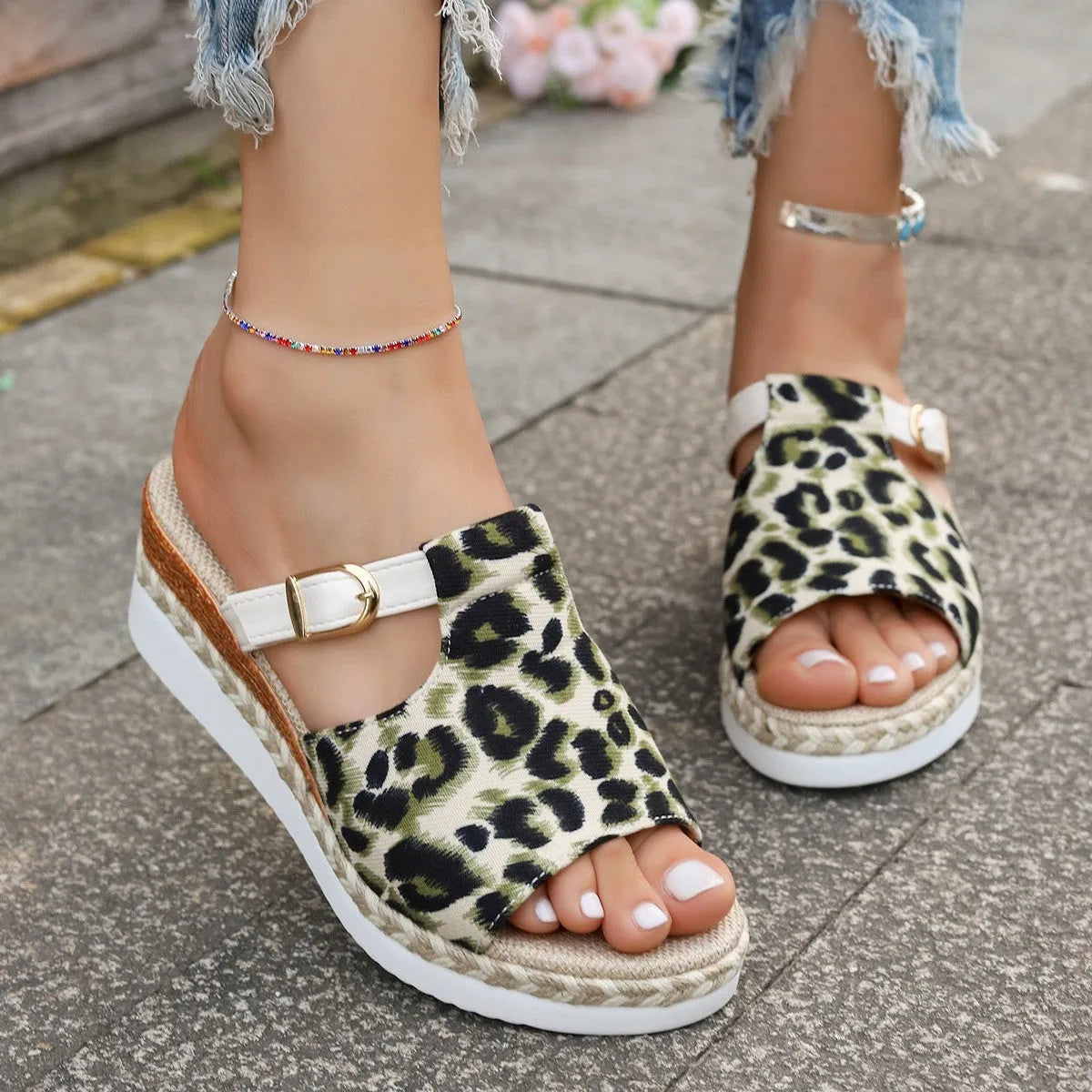 Leopard print women's platform sandals with a wedge sole and fish-mouth toe.