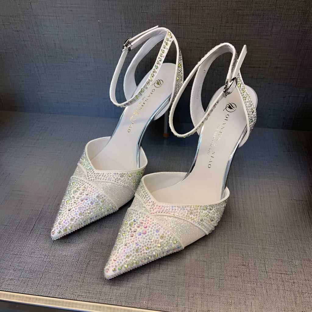 Women's silver and black hollow high heels with red sole and pointed toe design