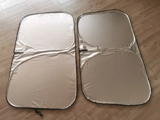 Aluminium foil car sunshade showing reflective silver surface with size dimensions displayed