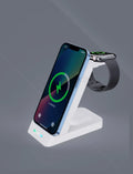 Black wireless 3 in 1 charging station with phone standing vertically on ABS+PC construction