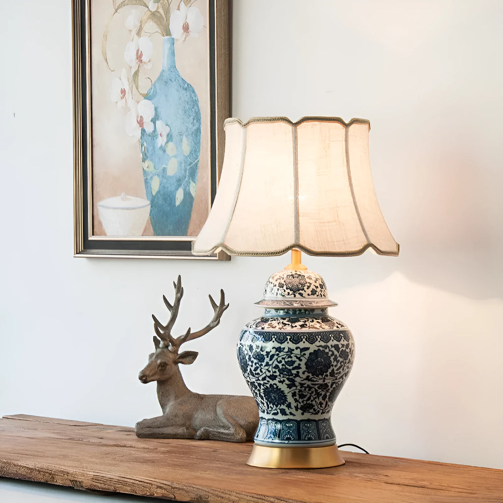 Handmade blue and white Chinese porcelain ceramic table lamp with copper base and fabric shade.