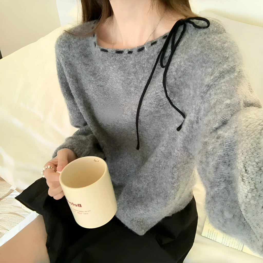 A grey loose-fitting women's knitwear pullover made from regenerated cellulose fibre.