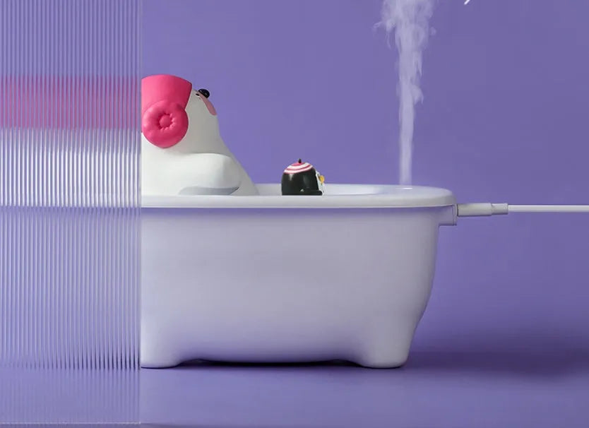 White USB air humidifier and scent diffuser with 550ml tank on a desk