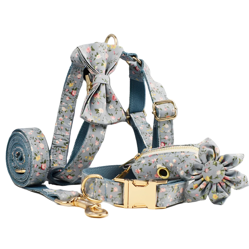 Blue floral pattern dog collar set with matching accessories including bow, leash and vest