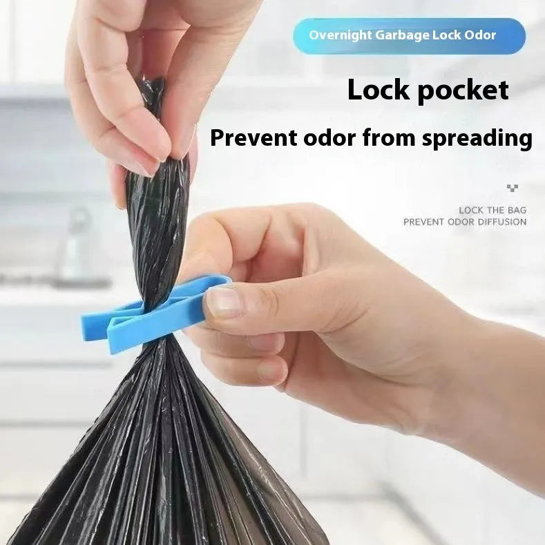 A white PP plastic clip designed to secure a bin bag to the side of a kitchen rubbish bin.