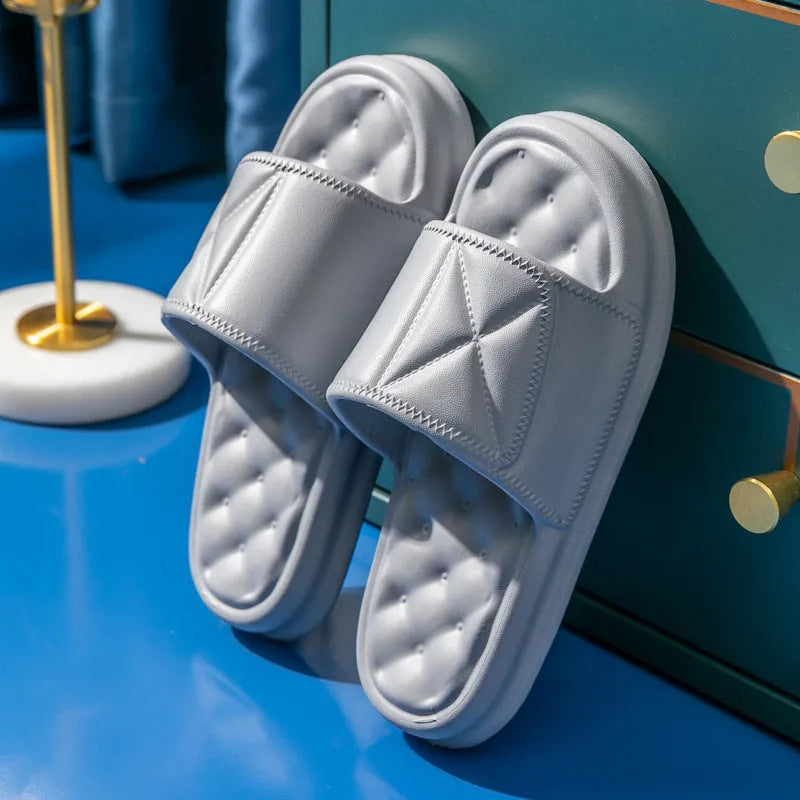 Pair of thick-soled EVA bathroom sandals in a chosen colour, showing moulded non-slip sole design.