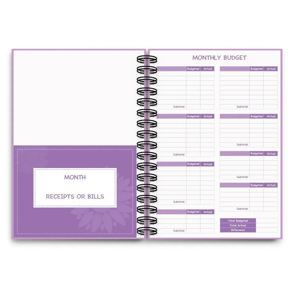 J12 purple coil-bound financial planning notebook with pen, stickers, and paper clips