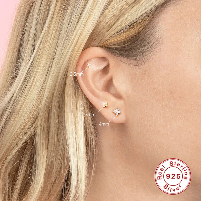 S925 sterling silver stud earrings with a geometric petal crystal flower design in gold or platinum finish.