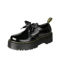 Women's thick soled leather shoes with ribbon cross straps and lace closure in black or white