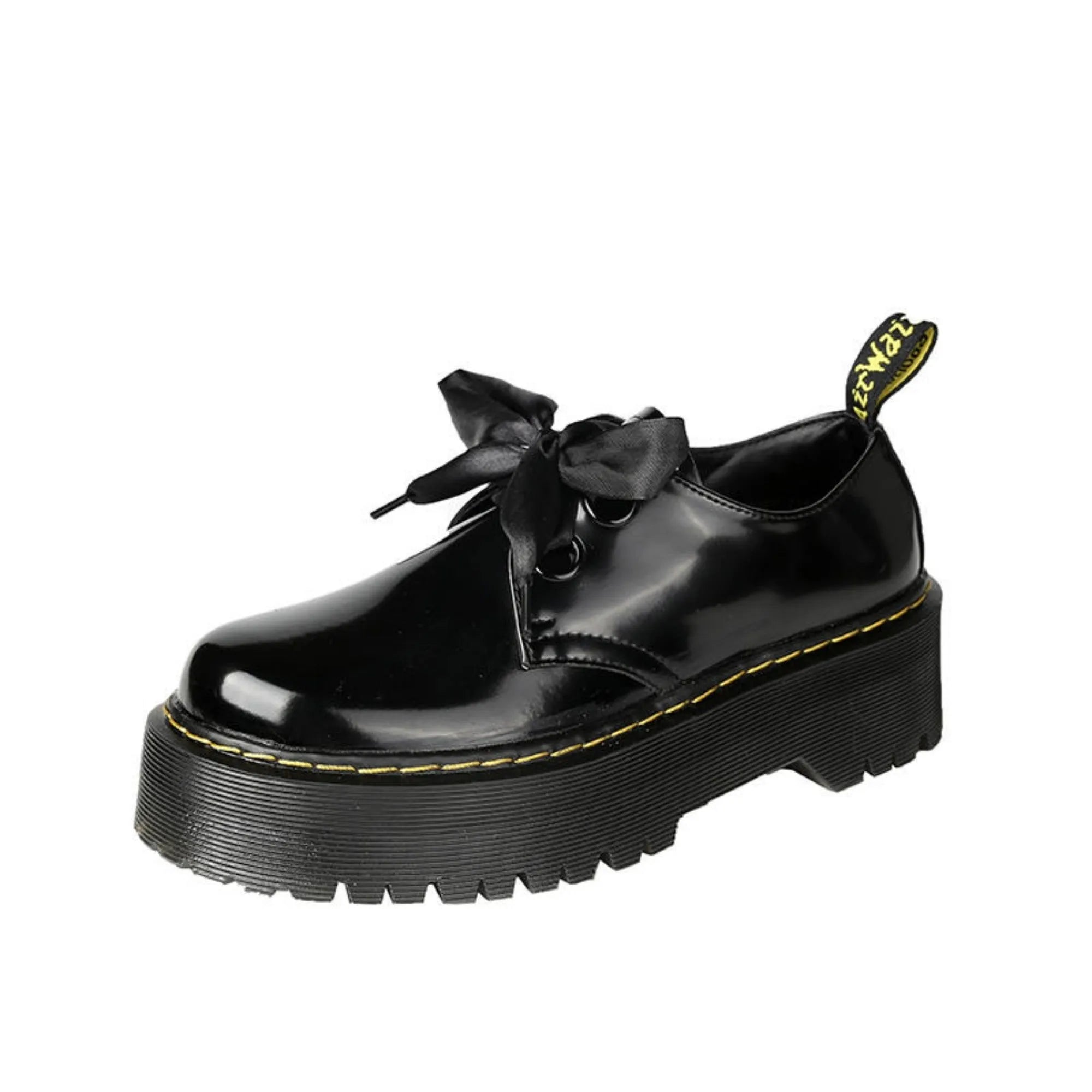 Women's thick soled leather shoes with ribbon cross straps and lace closure in black or white