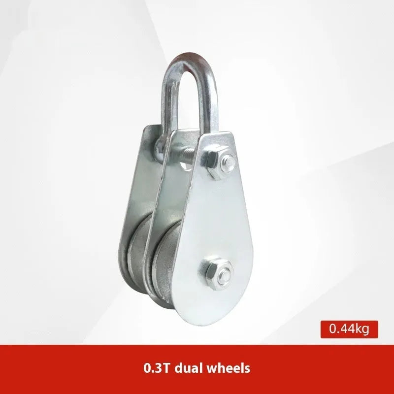Red forged steel lifting pulley with a safety latch on the hook, for industrial wire rope use.