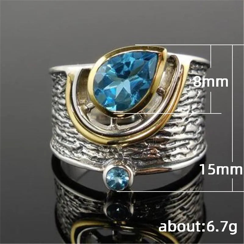 Chinese style women's blue zircon ring with drop shape design and inlaid detailing