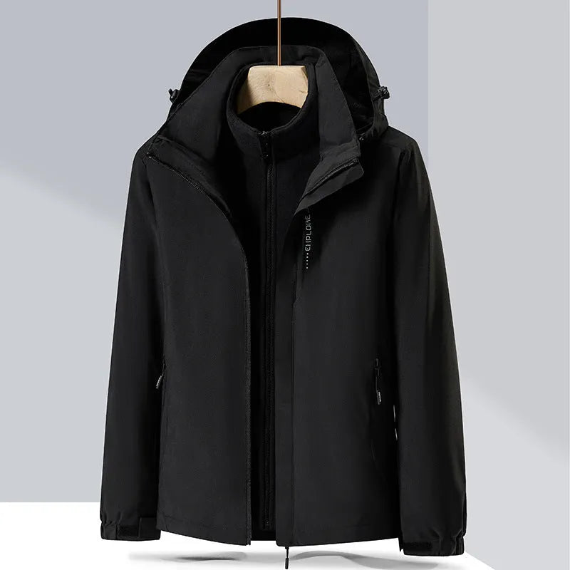 Men's black waterproof mountaineering jacket and trousers set with removable fleece lining.