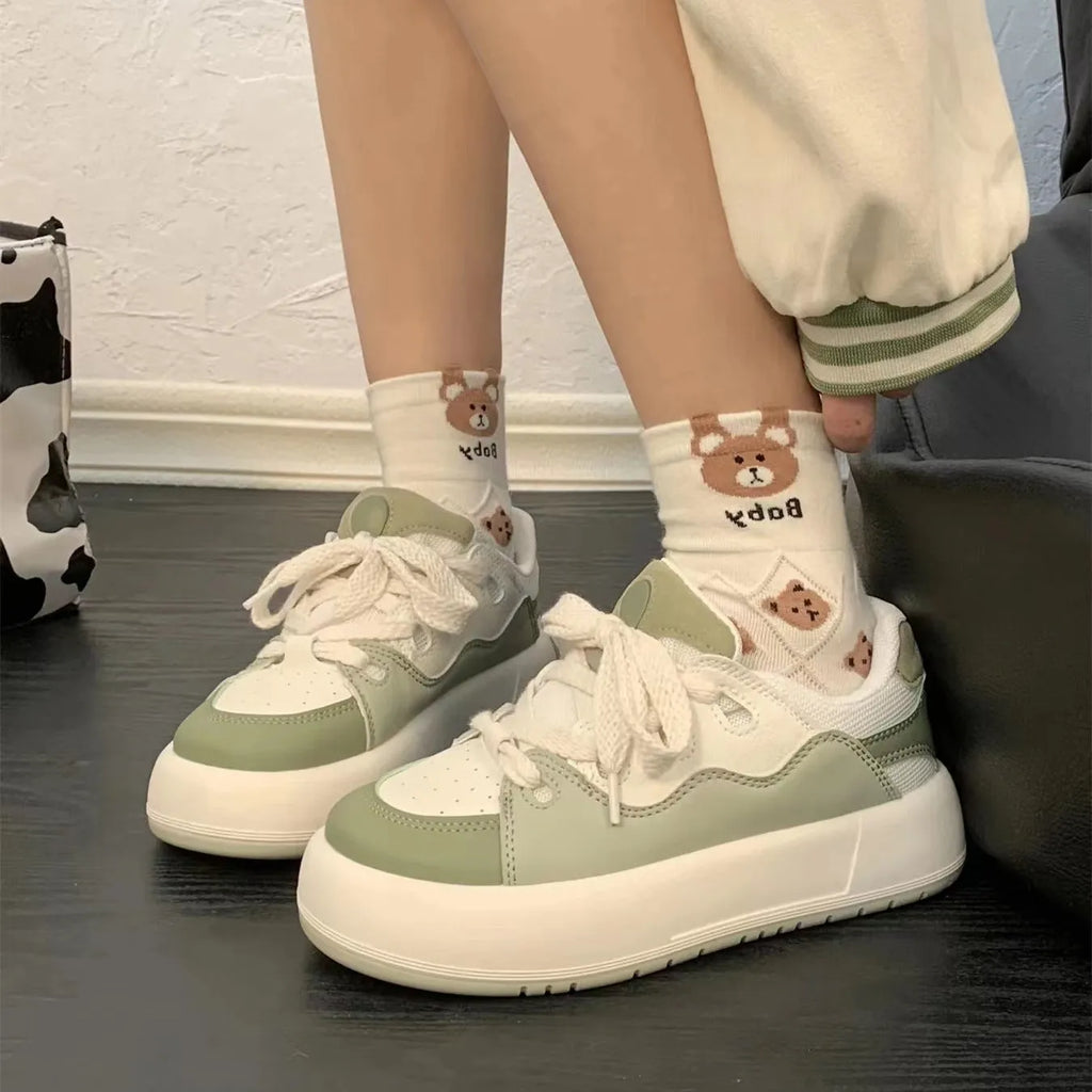 Green women's casual shoes with mesh upper, round toe, and flat heel design