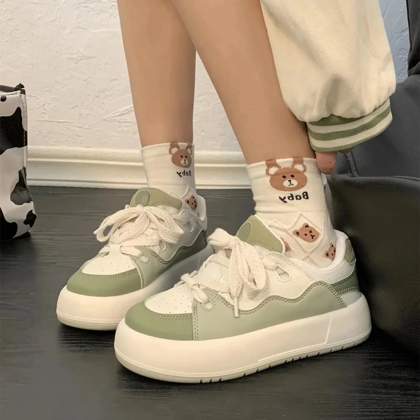 Green women's casual shoes with mesh upper, round toe, and flat heel design