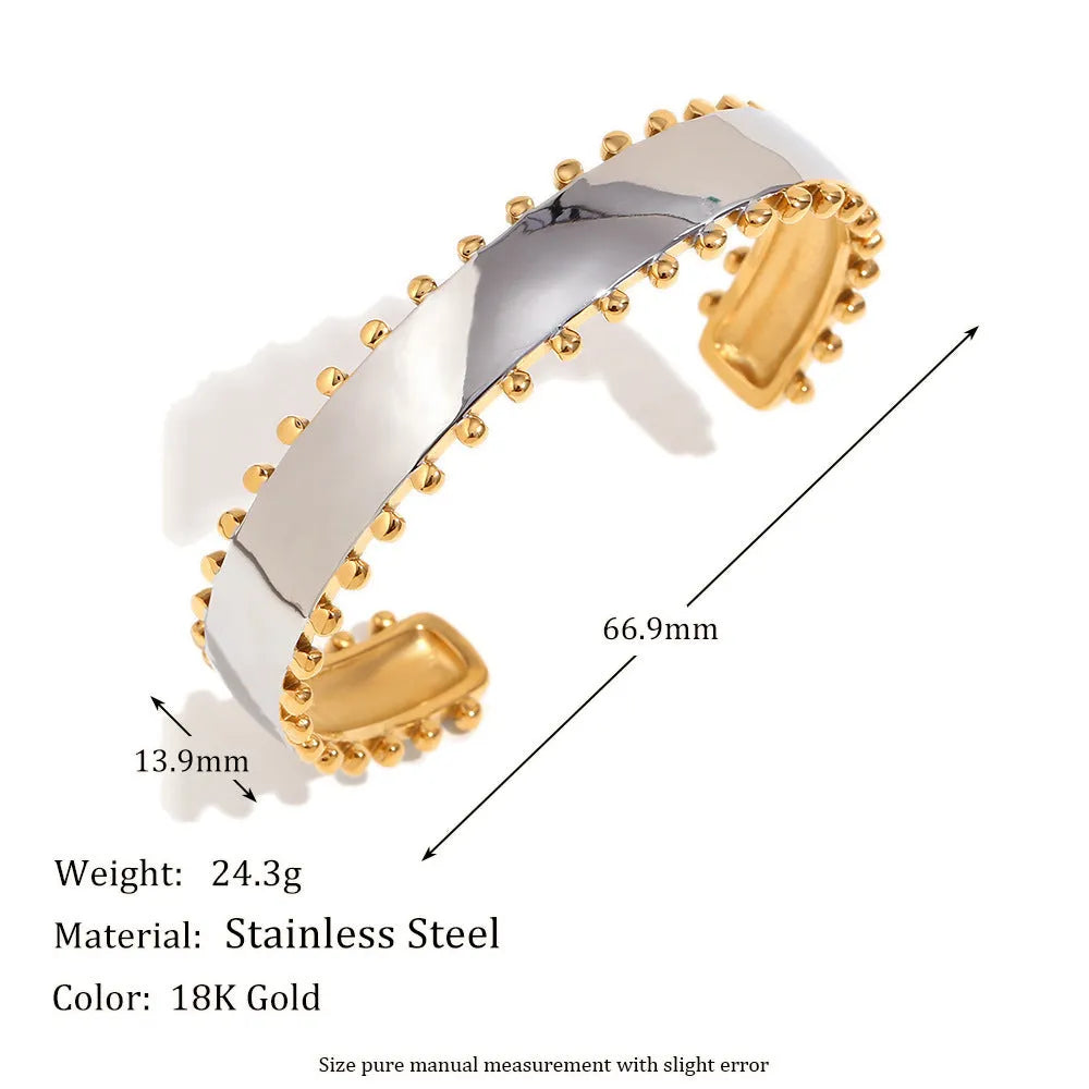 Gold electroplated geometric jewellery set with earrings, bracelet, and necklace on stainless steel