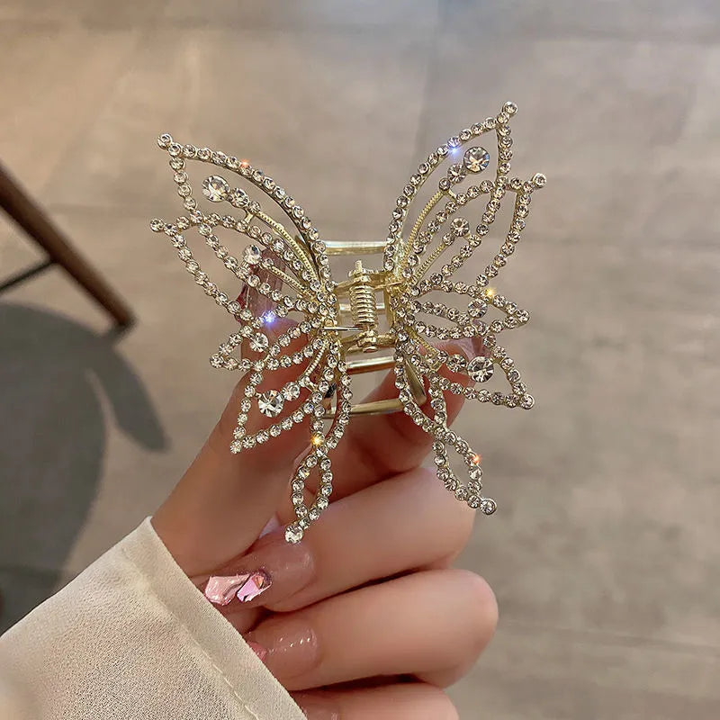 Butterfly-shaped alloy hair clip barrette for women, shown in rhinestone and pearl style options.