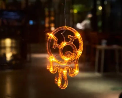 Set of seven Halloween-themed LED hanging lights with suction cups for window display