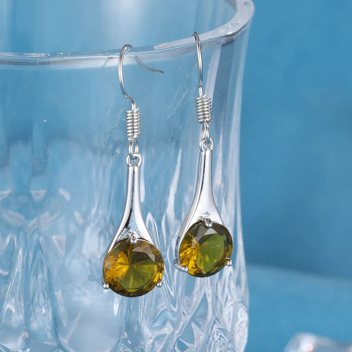 Olive green topaz water drop shape earrings with retro minimalist design and electroplated alloy construction