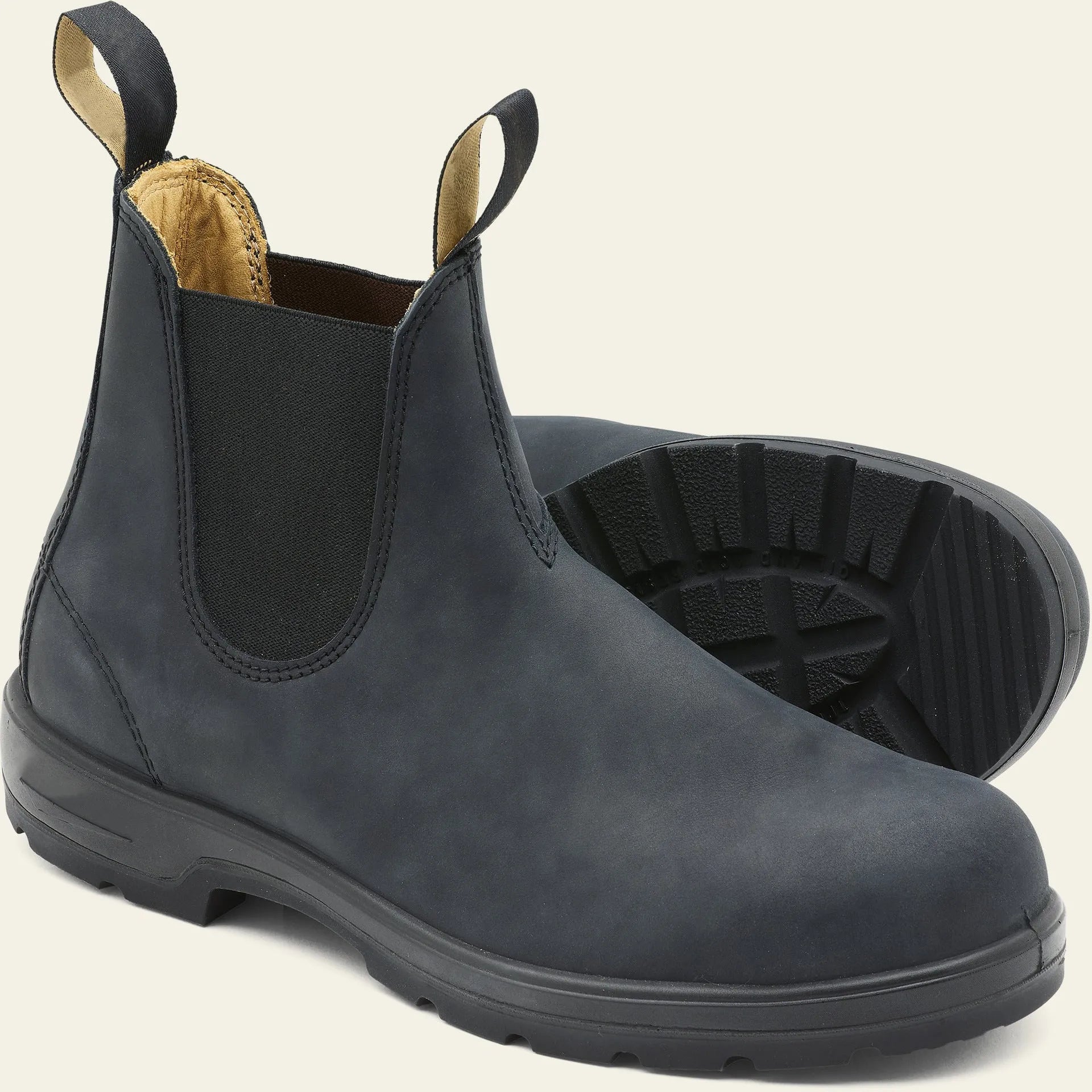 Unisex vintage brown Chelsea boots with a chunky sole and round toe on a white background