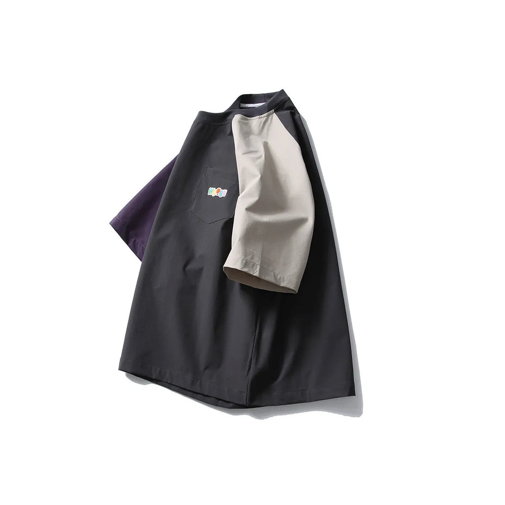 Dark grey men's loose fit t-shirt with contrast colour raglan short sleeves.