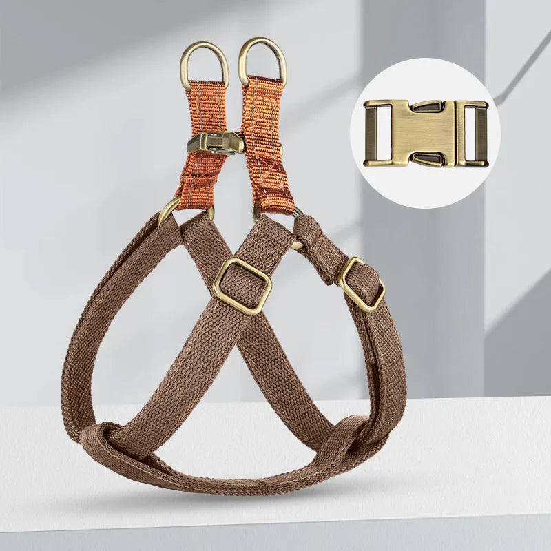 Brown vest-style dog leash with cotton belt and alloy fastener on a dog.