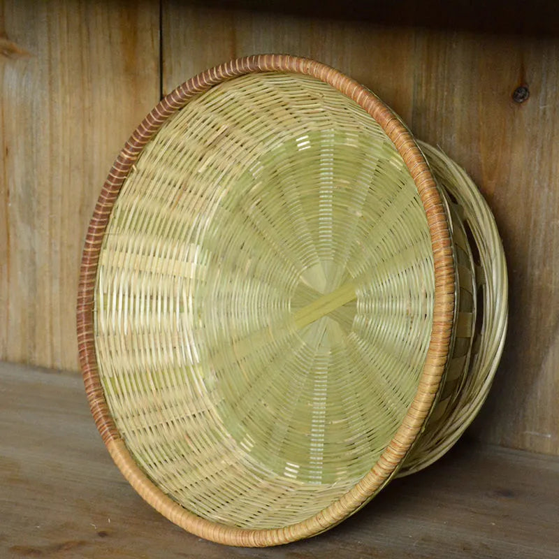 Handmade natural bamboo storage basket shown in one of three size options for household organisation.