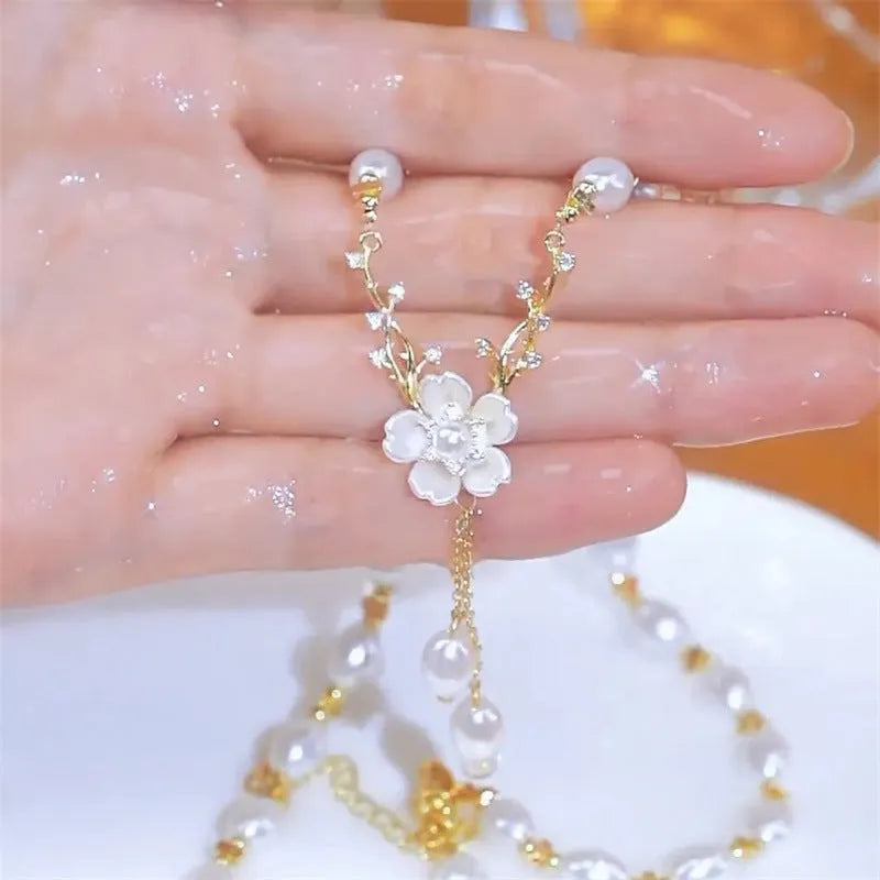 Alloy pearl flower necklace with rose accents on model