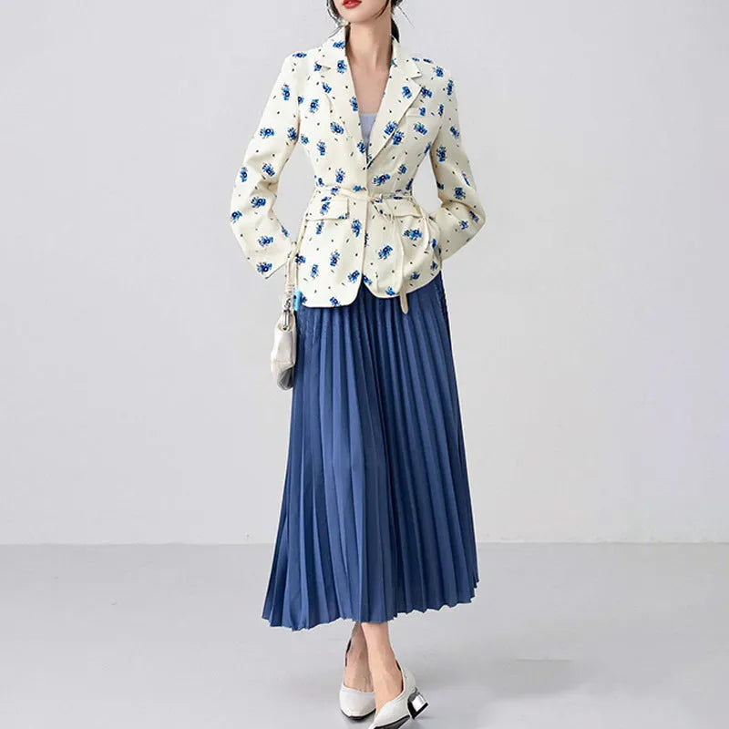Women's white blazer with a lace-up fastening detail at the waist, shown on a hanger.