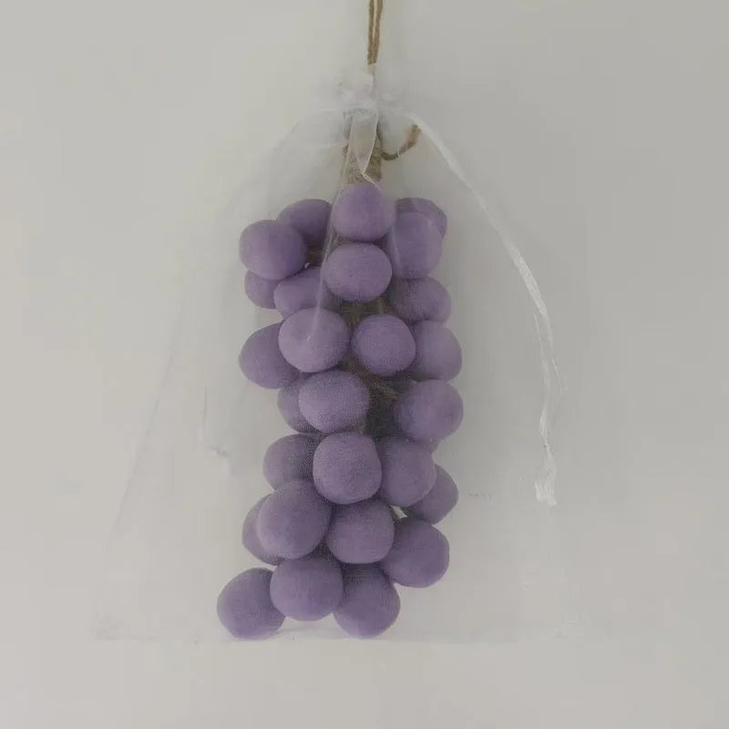 Handmade grape soap bars in black, green, and purple grape scents alongside litchi soap, with gift box and mesh bag packaging