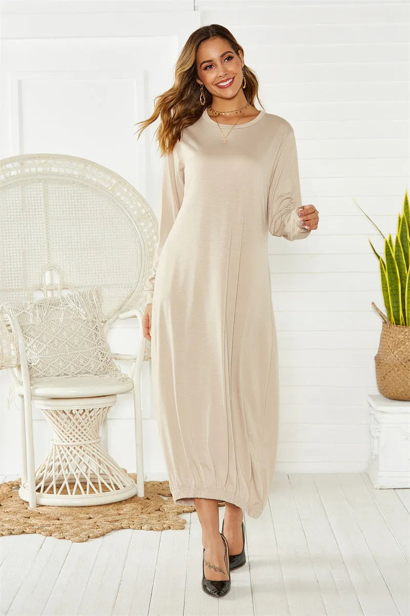 Black lantern dress with lace-up crew neck and loose silhouette, shown front view