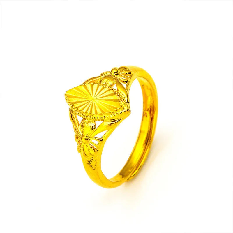 Gold geometric ring with open diamond floral pattern and textured surface